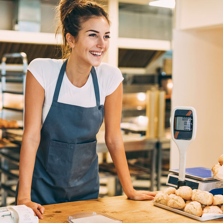 Woman baking bread in apron